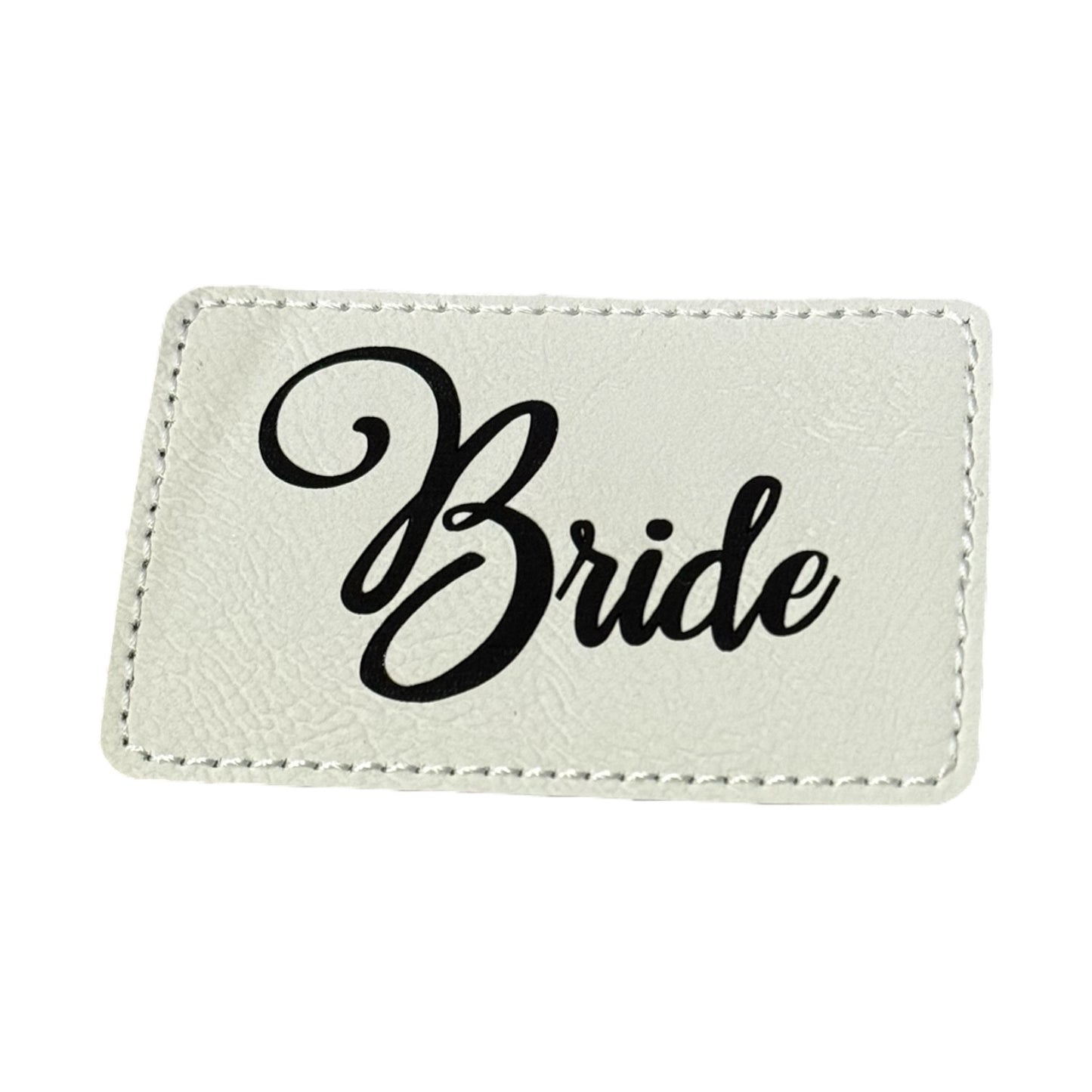 Laserable leatherette patch with adhesive