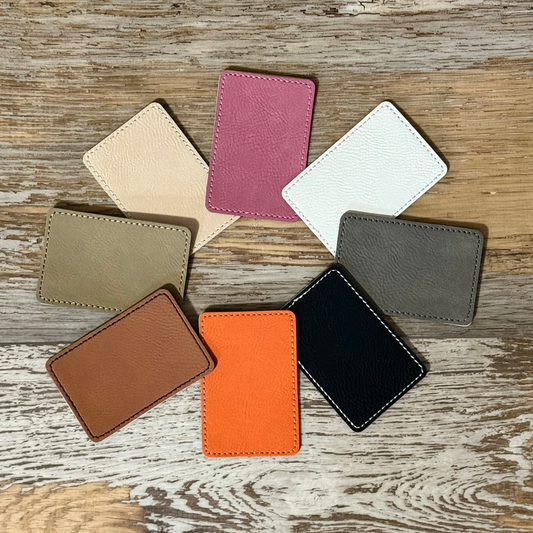 Laserable leatherette patch with adhesive