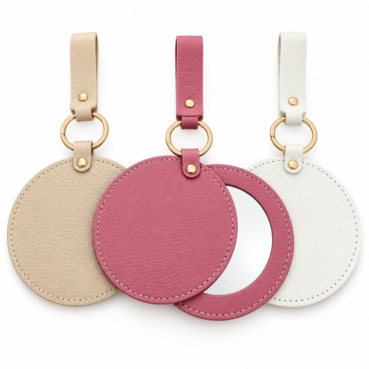 round leatherette compact mirror blanks in Tan, pink, and white with gold key rings and straps. Pink mirror shown open with sliding cover. Suitable for laser engraving and UV printing.