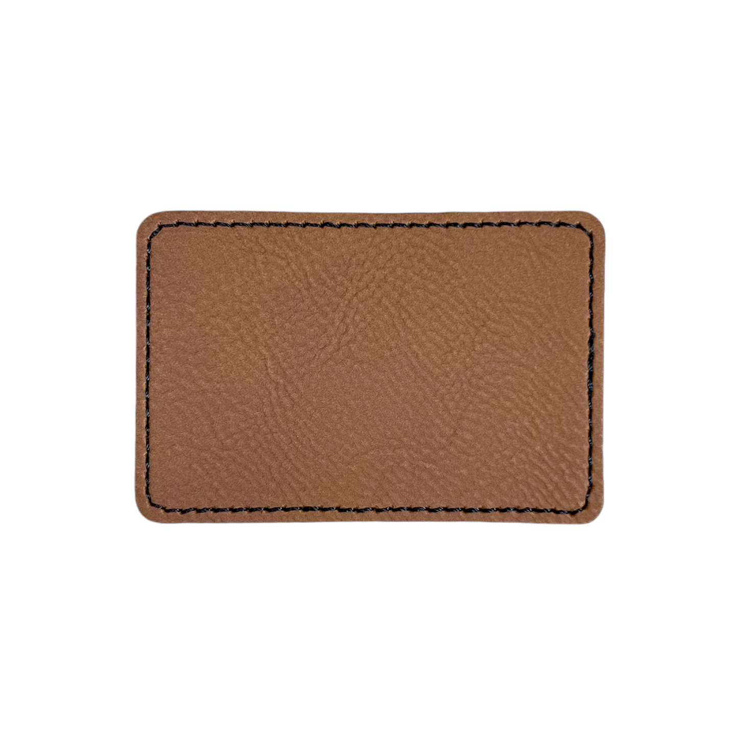 Laserable leatherette patch with adhesive